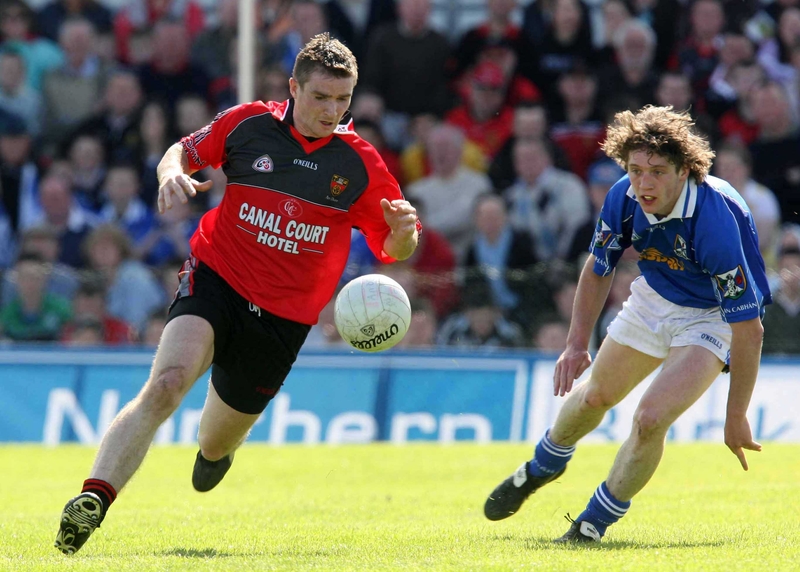 Liam Doyle of Down gets away from Cavan's Anthony Gaynor