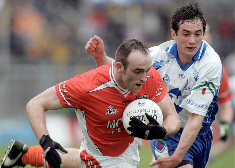 Malachy Mackin takes the ball away from Damien Freeman of Monaghan