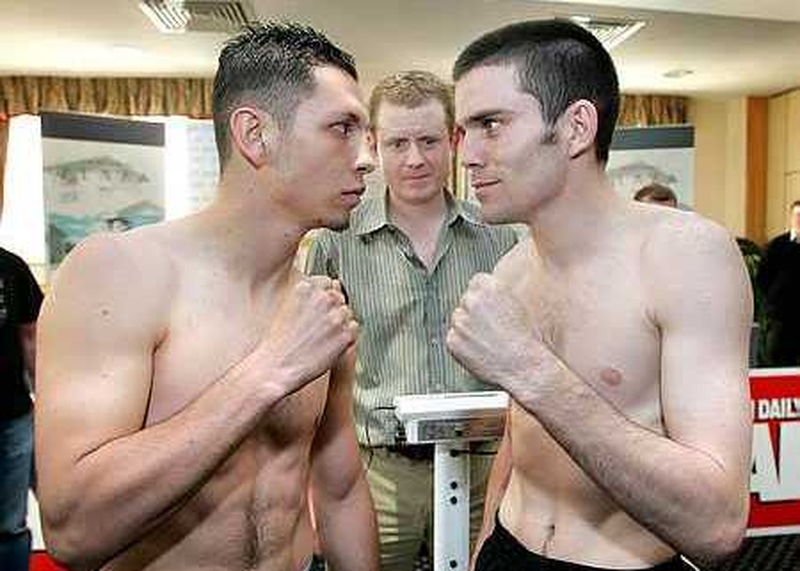 Bernard Dunne (right) squares up to David Martinez at the weigh-in