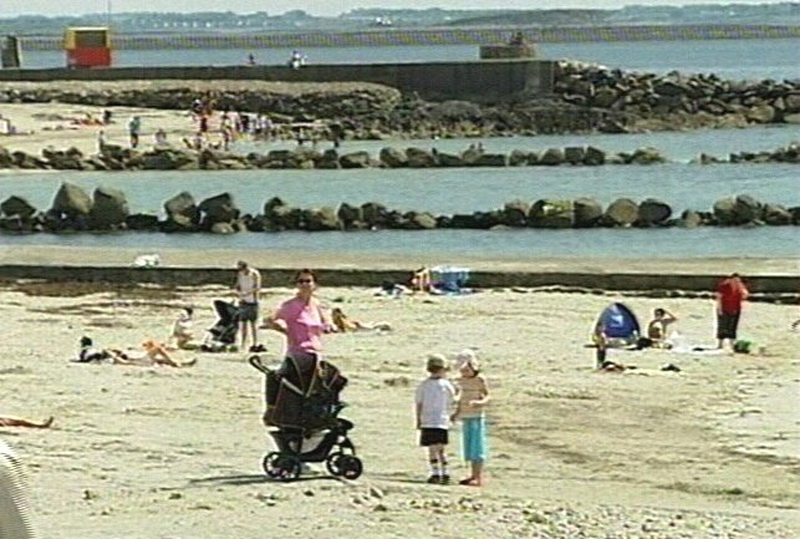 Sun bathing - Cancer society warns of under use of sun cream on hottest day