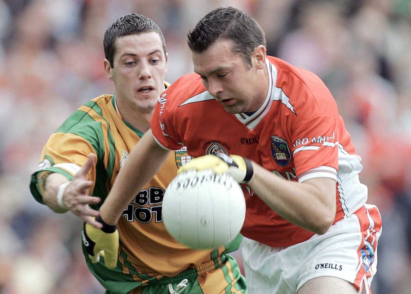 Armagh's Oisín McConville goes past Donegal's Barry Dunnion