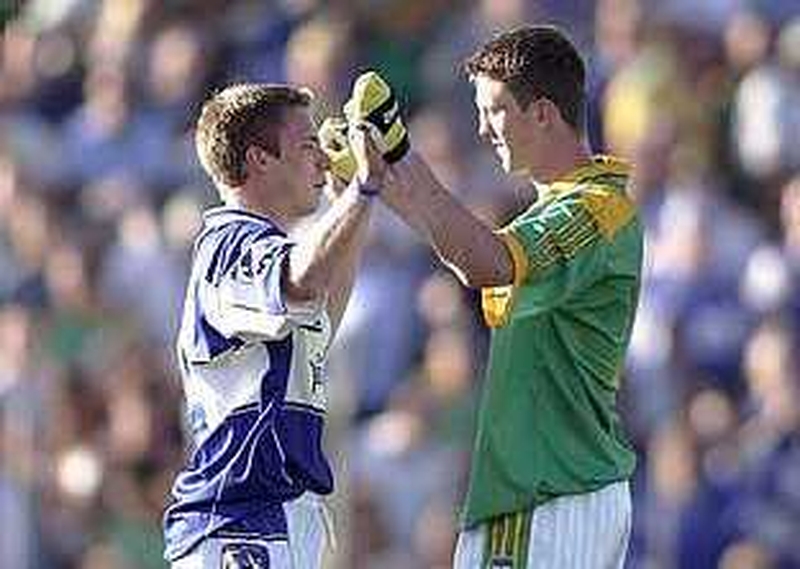Laois marksman Ross Munnelly (l) and Meath's Kevin Reilly (r) embrace at the final whistle