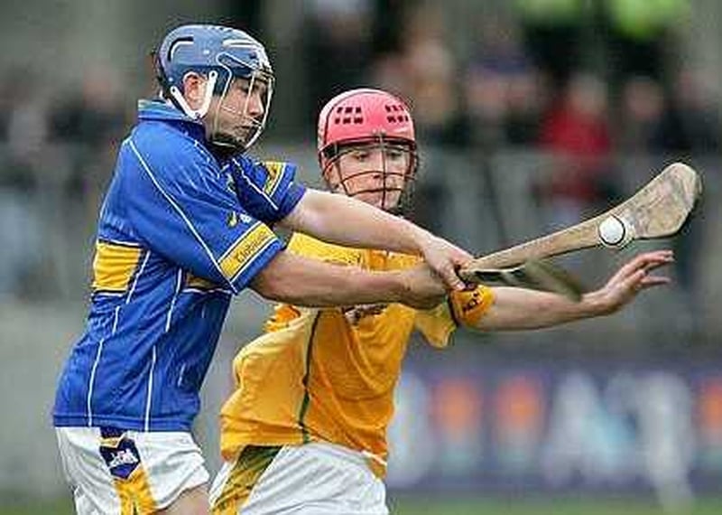 Tipperary's David Young is challenged by Colm Duffin of Antrim