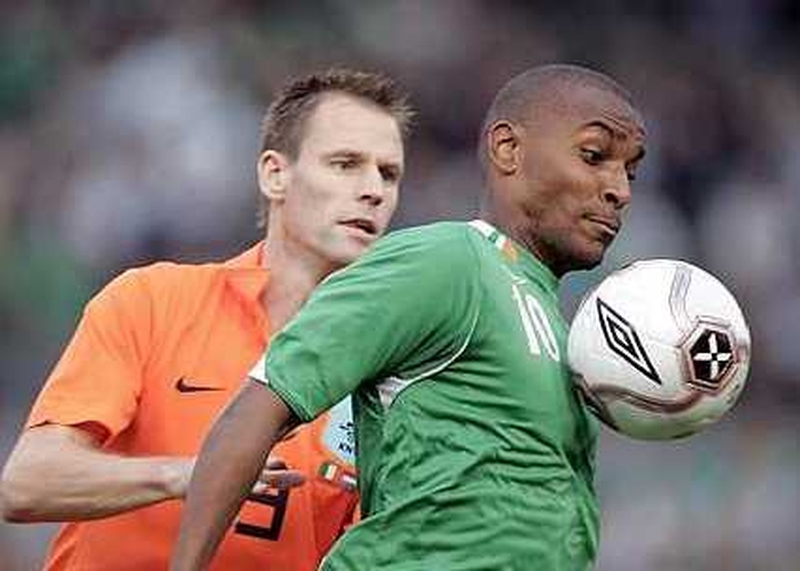 Andre Ooijer (left) marshals Clinton Morrison during last week's international friendly at Lansdowne Road