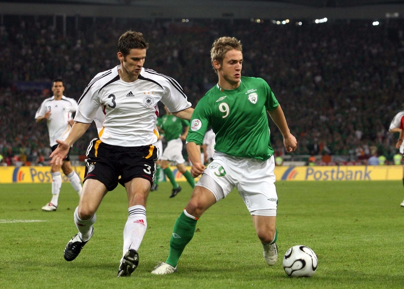 Ireland's Kevin Doyle holds off Arne Friedrich of Germany