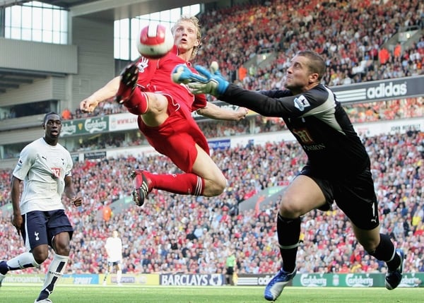 Liverpool's Dirk Kuyt will be out of action for up to two weeks with an injury picked up on international duty