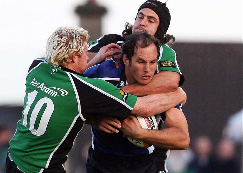 Girvan Dempsey struggles to free himself from a double Connacht challenge during their recent Magners League clash