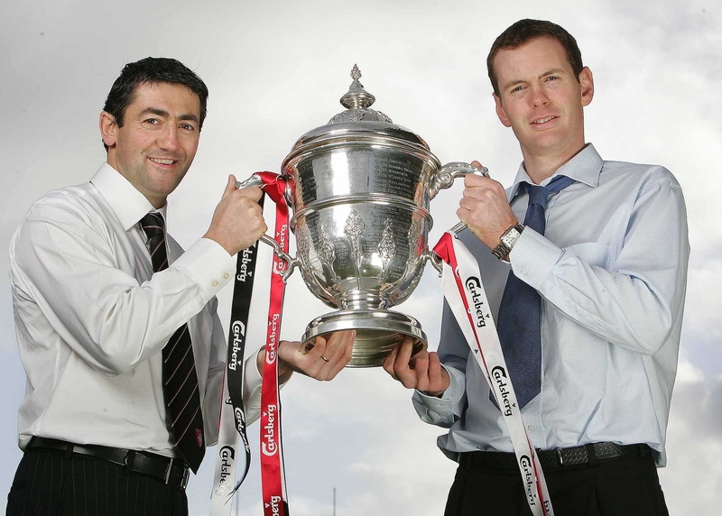 Derry City's Peter Hutton and Colm Foley of Saint Patricks Athletic with the trophy