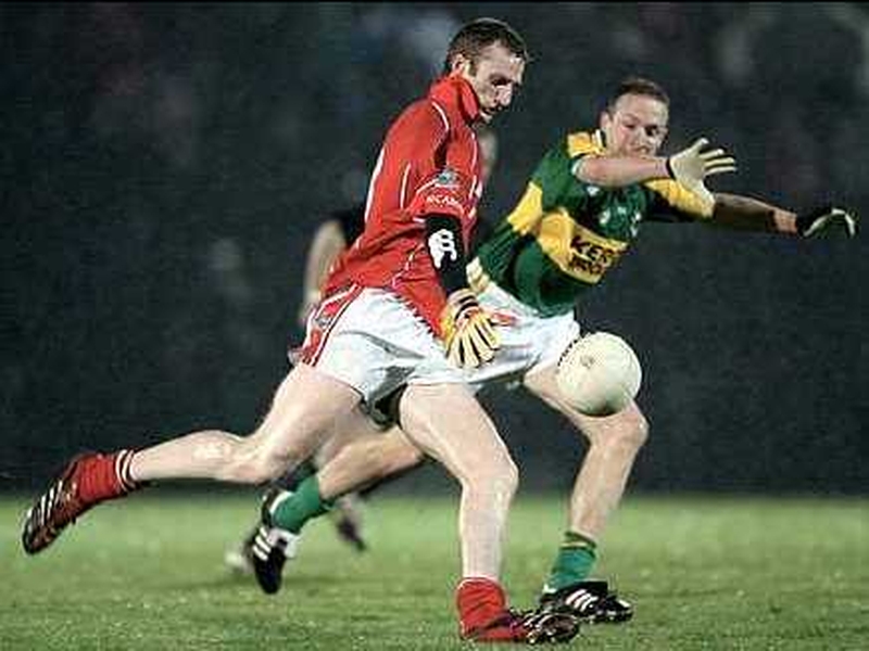 Cork's Nicholas Murphy tries to get his kick away as Kerry's Tommy Griffin attempts to block