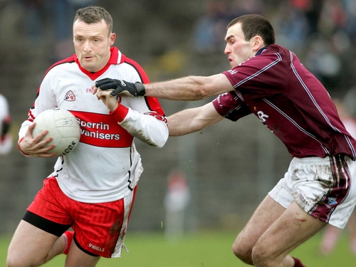 Derry's Paddy Bradley goes past Michael Ennis