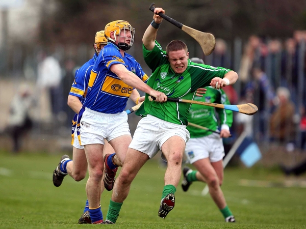 Tipperary's Shane McGrath battles with Limerick's Michael Fitzgerald in Nenagh today