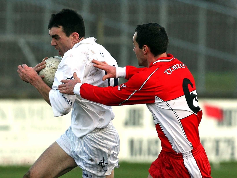 Kildare's John Doyle tries to escape the attentions of Derry's Sean Marty Lockhart today