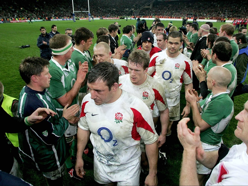 Dejected England players leave the pitch after their heavy loss in Croke Park