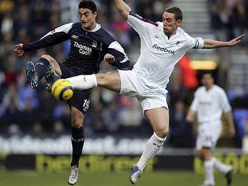 Kevin Nolan (right) has signed a new four-year deal at the Reebok Stadium