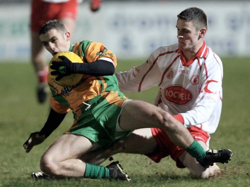 Tyrone's Davy Harte and Johnny McCloone of Donegal go to ground