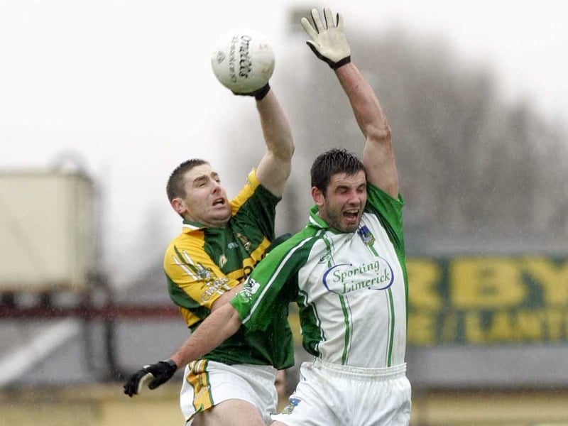 Kerry midfielder Darragh Ó Sé climbs above Limerick's John Galvin