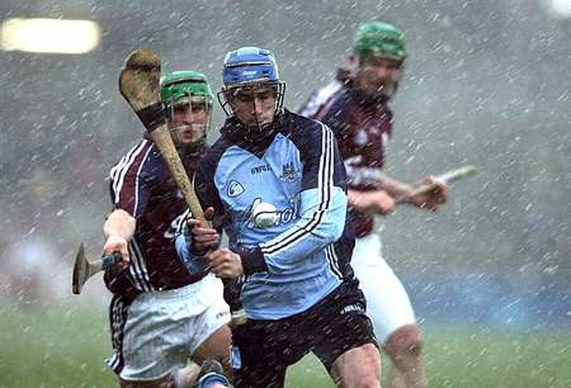 Dublin's Kevin Flynn tries to get the sliotar away as Galway's Fergal Healy closes in