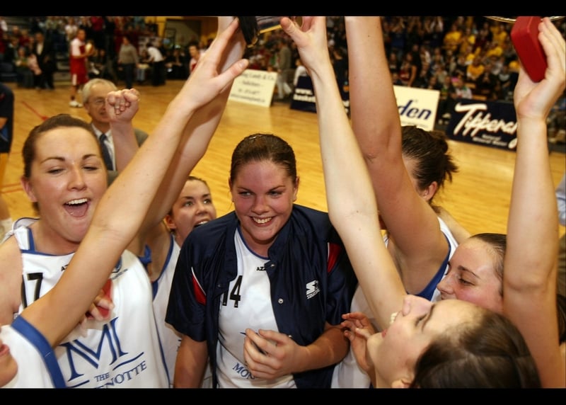 DCU Mercy captain Marie Breen celebrates the Women's SuperLeague Championship Final with her team-mates