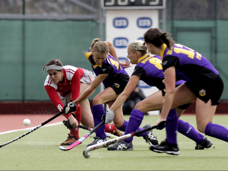 Nadine Brown of Pegasus clears as Pembroke players close in