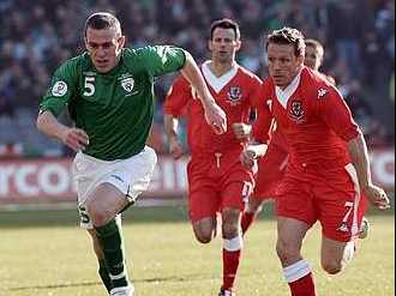 Richard Dunne (left) races Craig Bellamy to the ball last Saturday