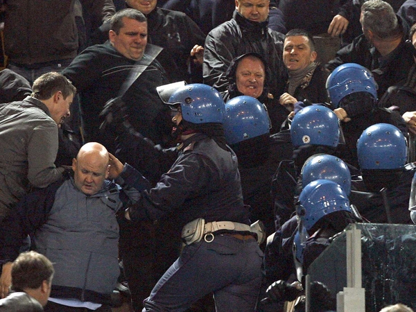 News of Sunday's shooting prompted trouble on the terraces at the game between Atalanta and AC Milan in Bergamo