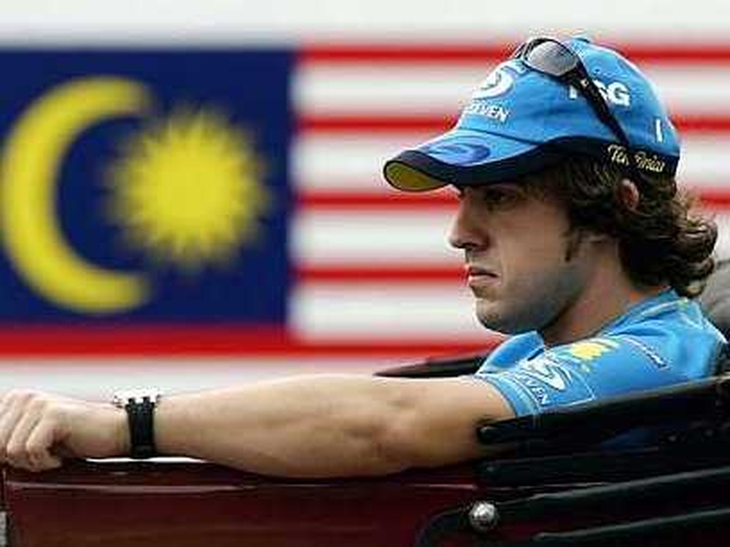 Fernando Alonso in pensive mood at last year's Malaysian Grand Prix