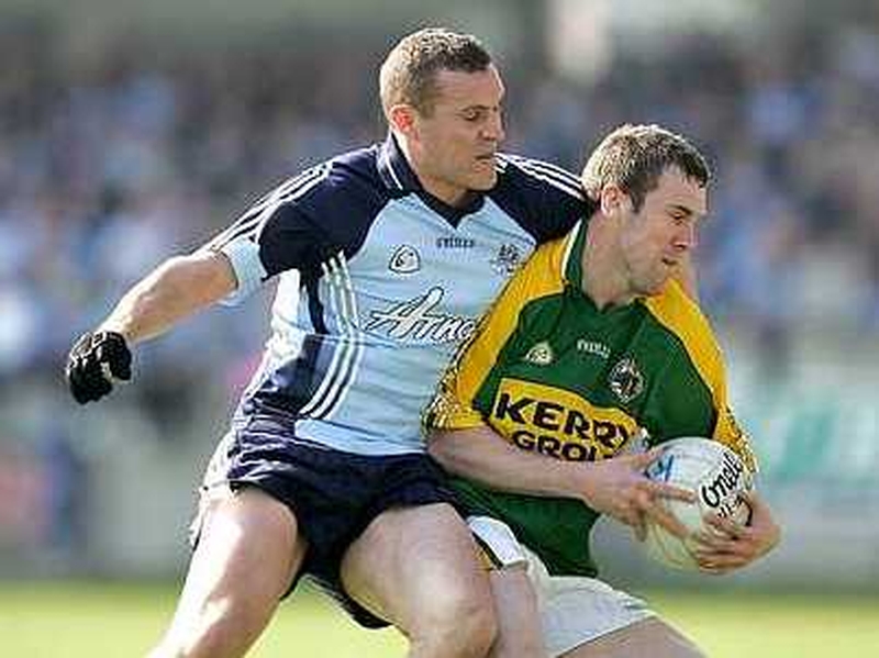 Dublin's Ciaran Whelan (left) welcomes Kerry's Daniel Bohan (right) to Parnell Park