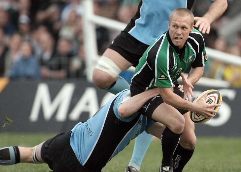 Connacht out-half Paul Warwick gets tackled by Glasgow's Alastair Kellock in the Magners League clash at the Sportsground