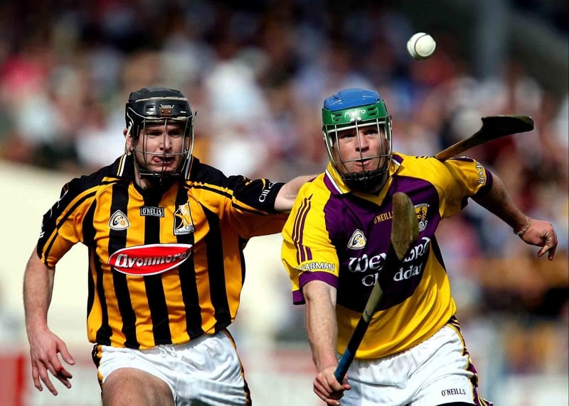 Wexford's Paul Carley gets past Kilkenny's JJ Delaney in the NHL Division One semi-final in Thurles