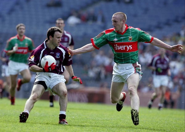 Galway's Derek Savage is watched by Mayo's David Heaney in the NFL Division One semi-final in Croke Park