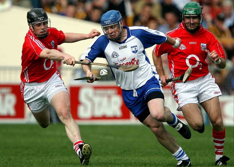 Waterford's Shane Walsh runs past Cork's Shane O'Neill in NHL Division One semi-final in Thurles
