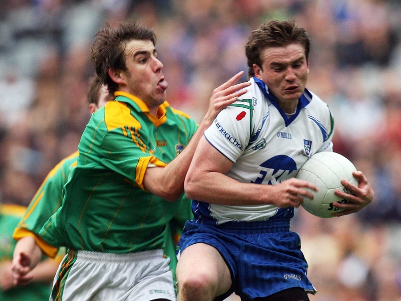Meath's Brian Farrell attempts to wrestle possession from Monaghan's Dessie Mone
