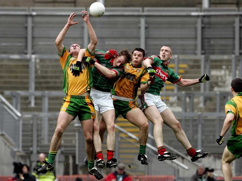 Players from Donegal and Mayo tussle for the ball at Croke Park