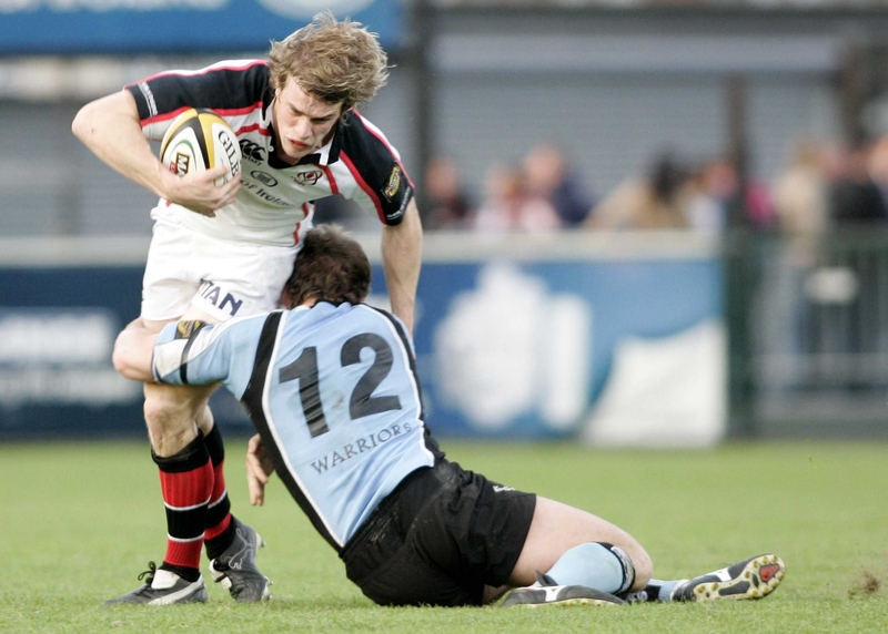 Andrew Trimble is tackled by Scott Barrow during tonight's Magners League encounter
