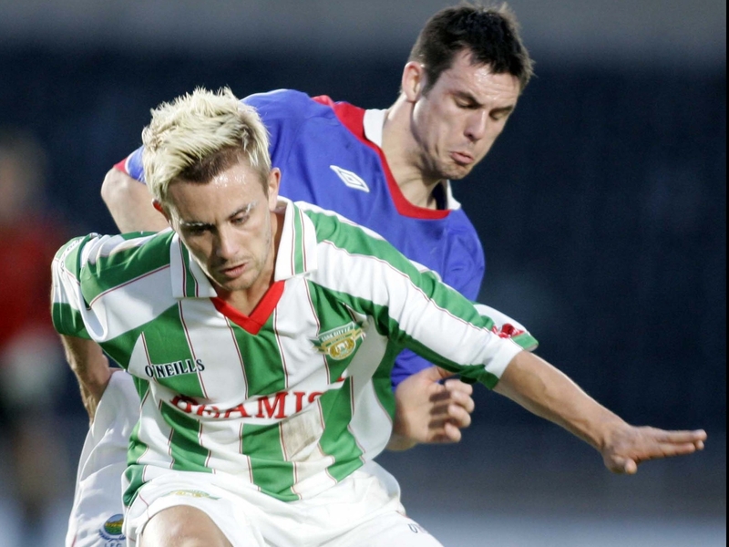 Liam Kearney holds off James Ervins in the semi-final clash at Windsor Park