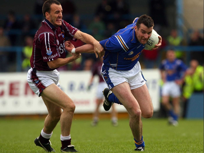 Longford's Liam Keenan under pressure from Westmeath's Damien Healy