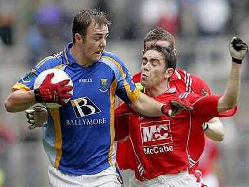 Wicklow's James Stafford shields the ball from John O'Brien of Louth