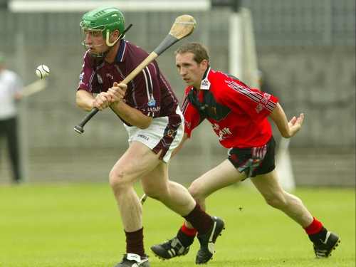 Andrew Mitchell of Westmeath and Down's Enda Loughlin in action today