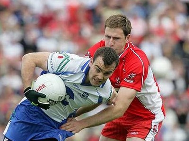 Monaghan's John Paul Mone is tackled by Enda Muldoon of Derry