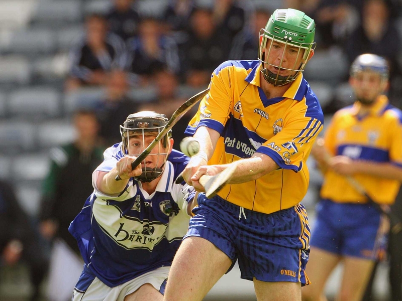 Laois' James Brophy attempts to block down Clare's Diarmuid McMahon