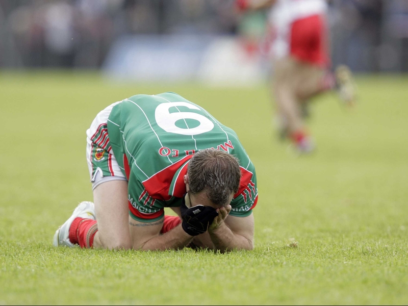 Mayo midfielder David Brady cannot hide his disappointment after defeat at Celtic Park