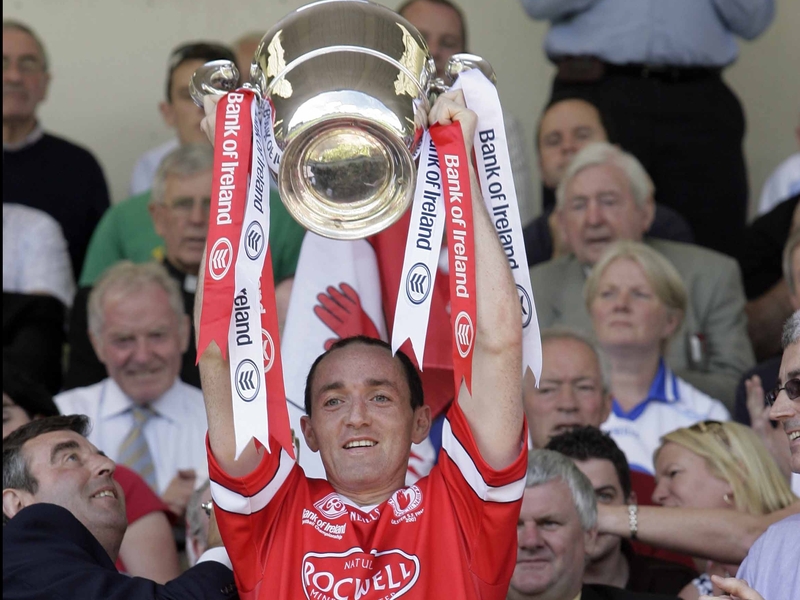 Brian Dooher lifts the Anglo-Celt Cup