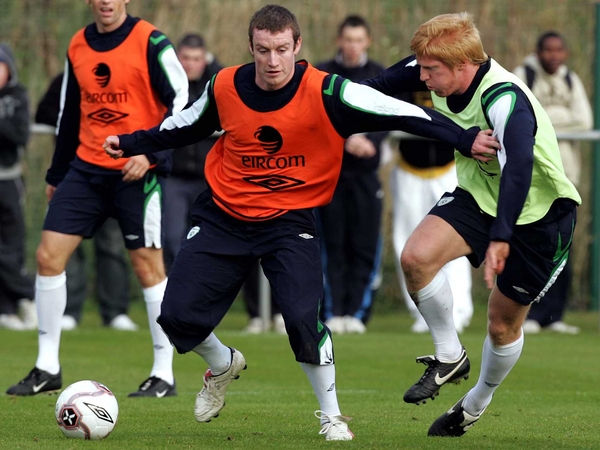 Stephen Elliott holds off Paul McShane during an Ireland training session