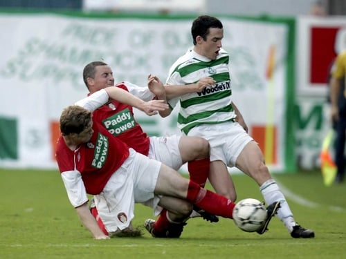 Stephen Paisley and Michael Keane challenge Rovers' Tadhg Purcell