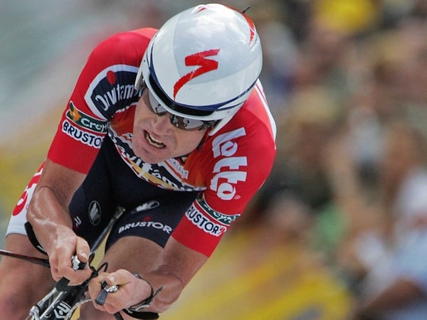 Cadel Evans battled through the pain barrier to take the yellow jersey