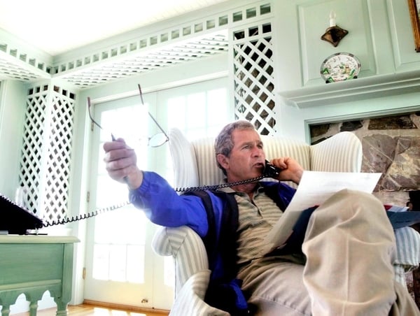 President George W Bush - Receiving 'regular updates' while on holiday in Maine