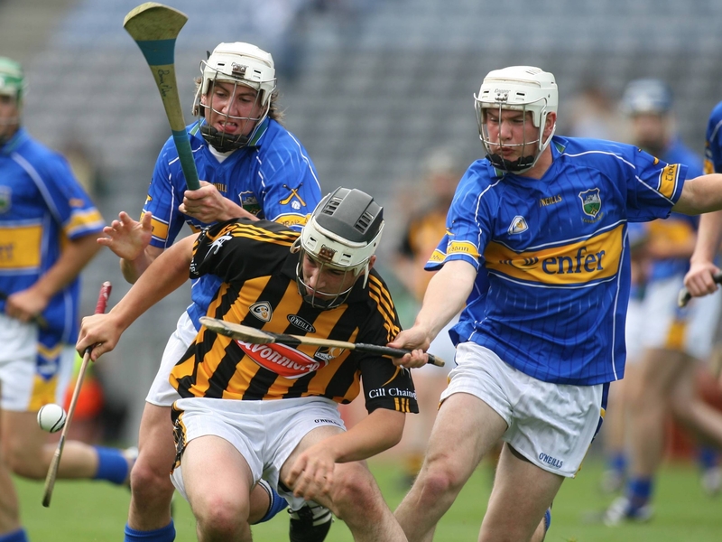 Tipp's Patrick and Brendan Maher close in on Kilkenny's Kieran Mooney