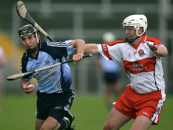 Dublin's Keith Dunne and Paddy Henry of Derry in action today
