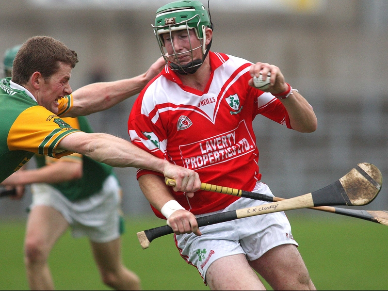 Loughgiel's Eddie McCloskey is challenged by Malachy Molloy of Dunloy