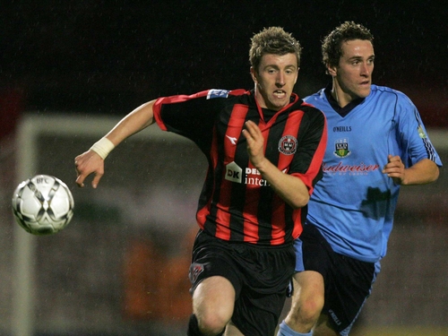 Dean Pooley of Bohemians gets to the ball before UCD's Fran Moran
